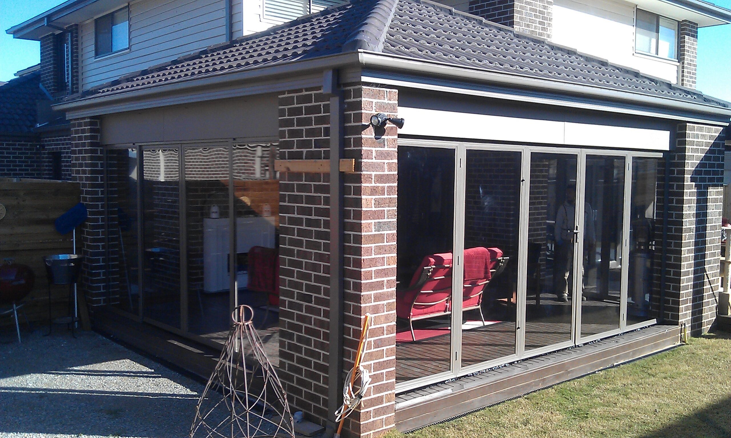 Full-Scale Outdoor Room Build with Screen Doors and Roofing