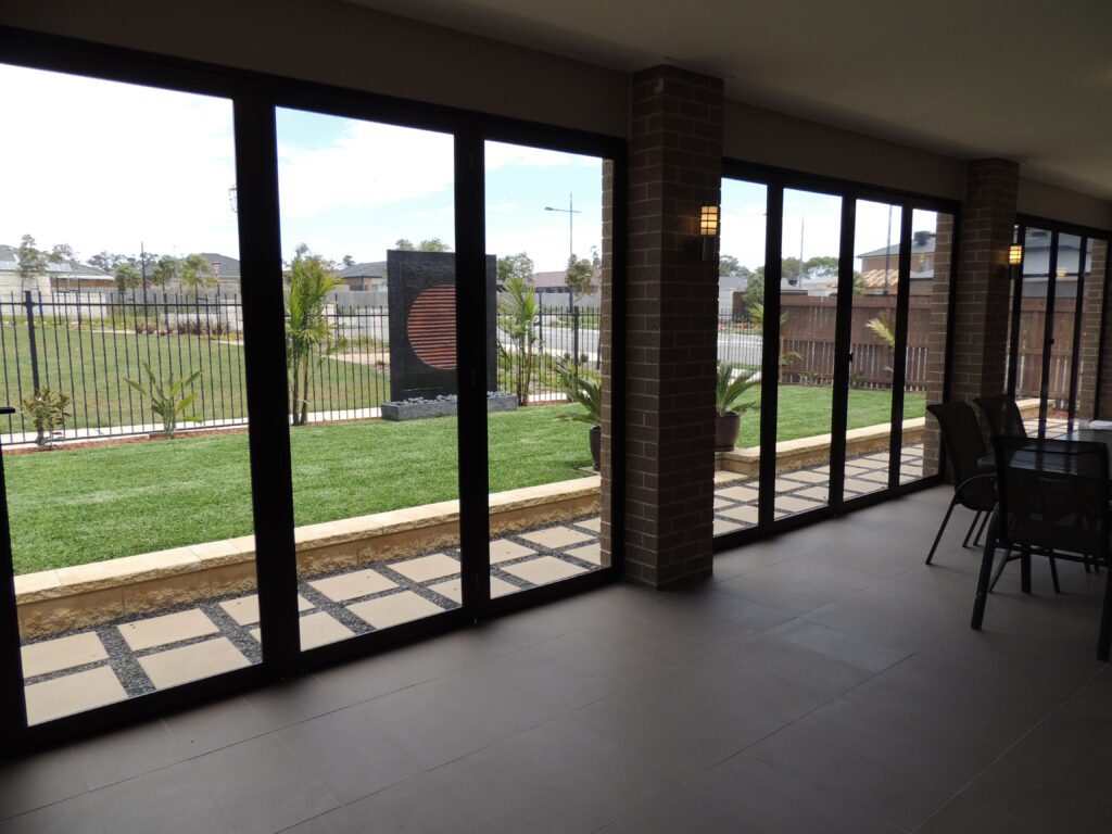 Framed Plexiglass Screens Installed in Outdoor Space