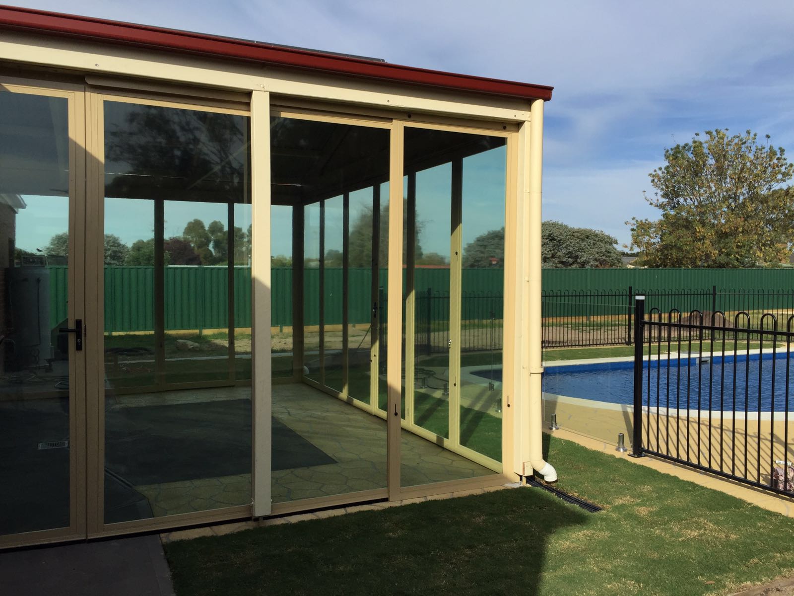 Outdoor Living by the Pool with Framed Screens