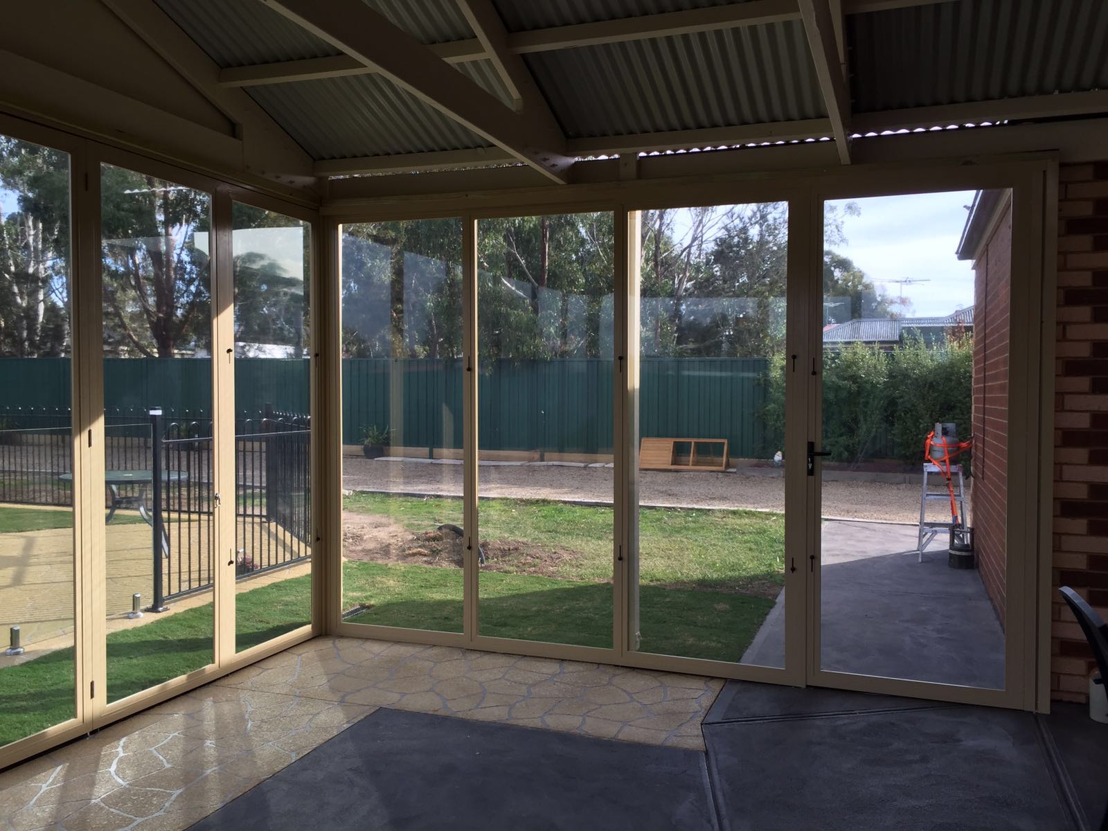 Poolside Outdoor Living Area with Sliding Doors